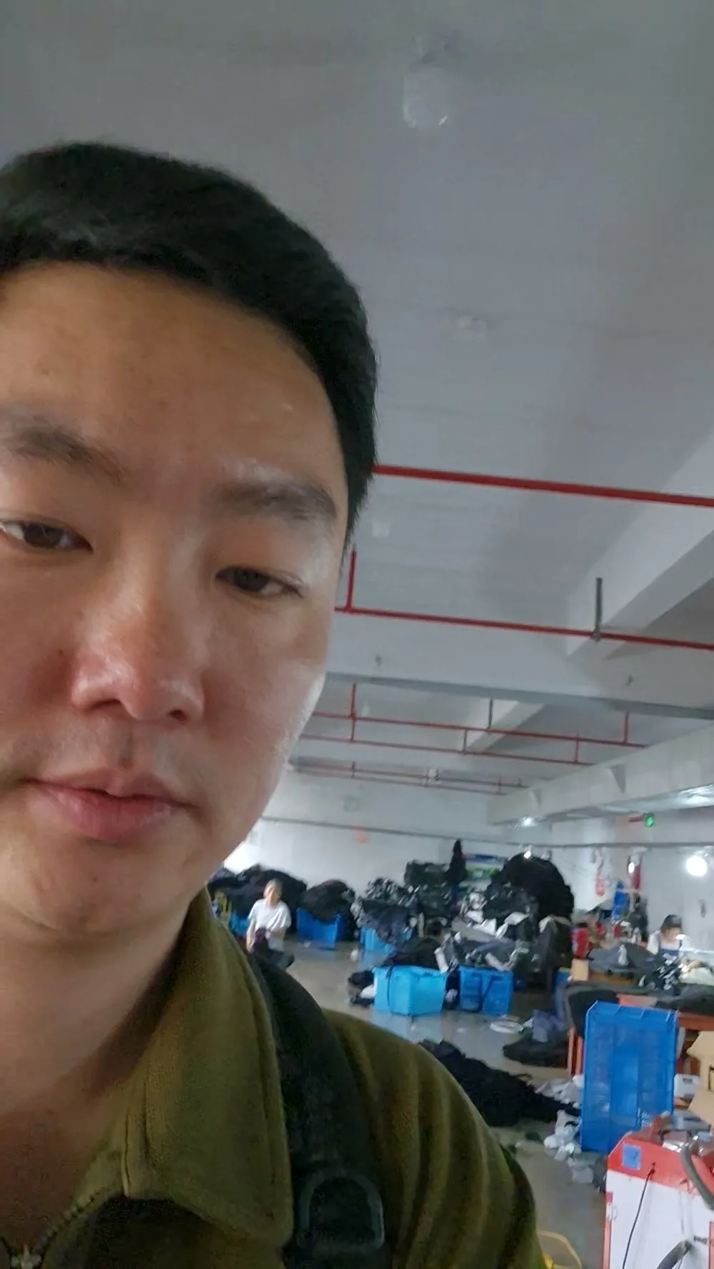 Sang, founder of Groundwork Sourcing, on a factory floor in China