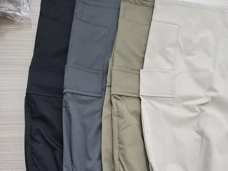 Four colourways of the same trouser style laid side by side