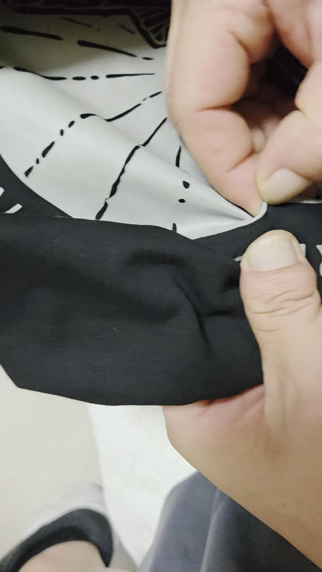 Checking a garment's print durability by hand