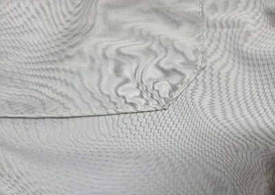 Fabric puckering along a seam